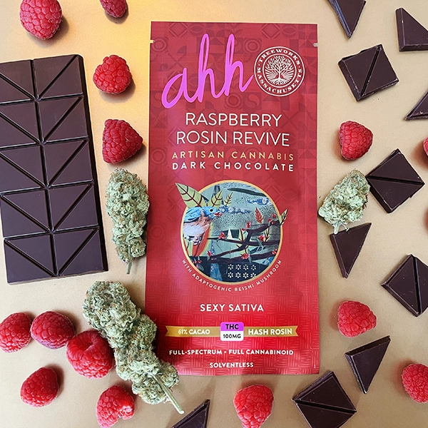 Raspberry Rosin Revive Dark Chocolate : Divine 61% Dark Chocolate with real raspberries swirled throughout, offers a delightful burst of tart sweet crunch. Infused with award winning Treeworks Hash Rosin